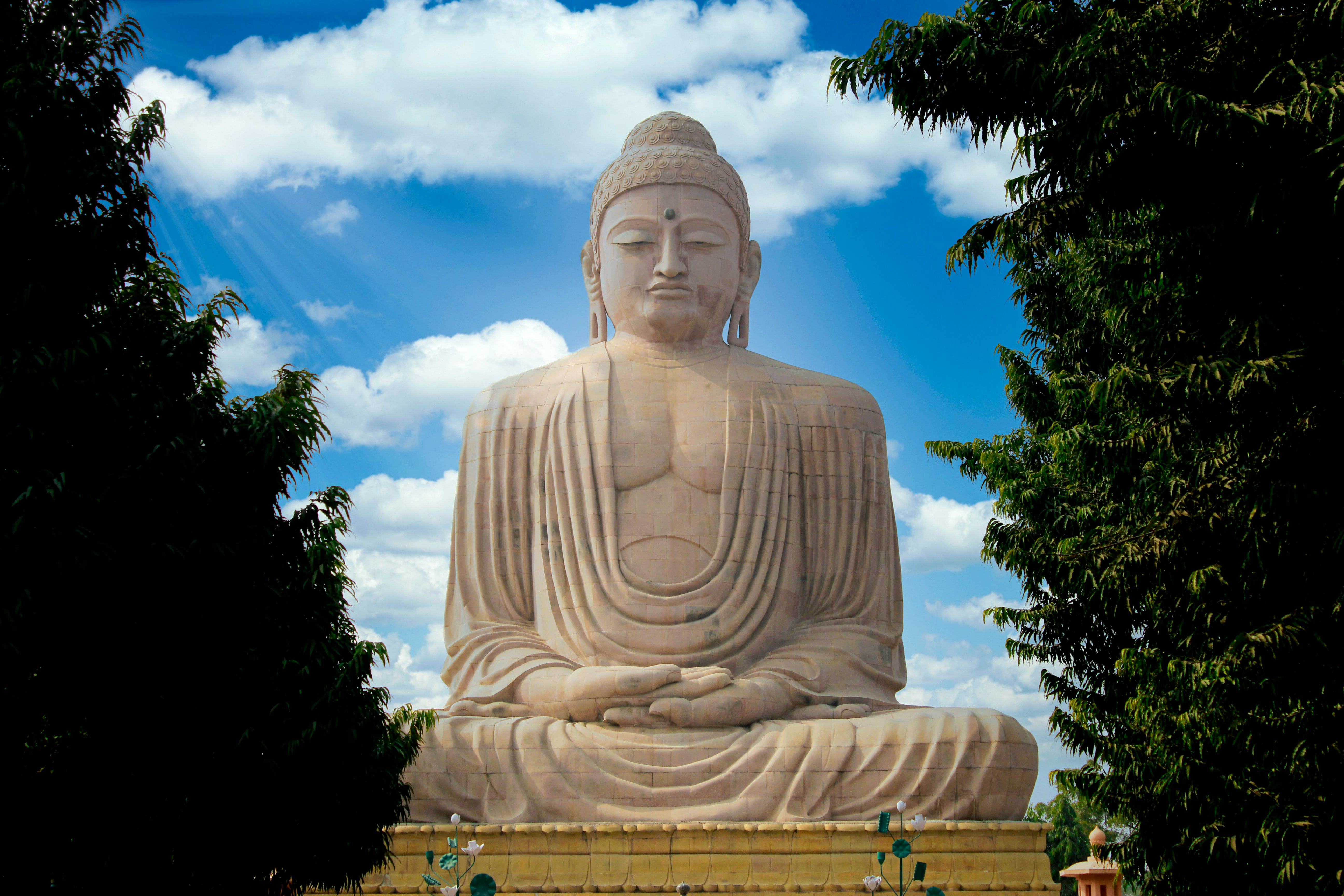 white concrete statue under blue sky during daytime